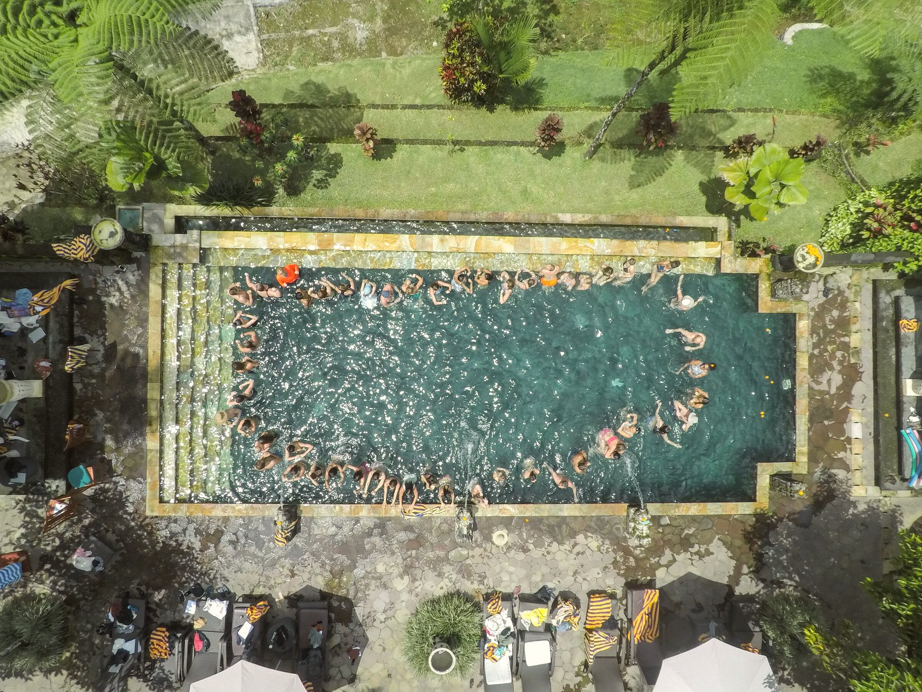 The group forming a circle in the pool